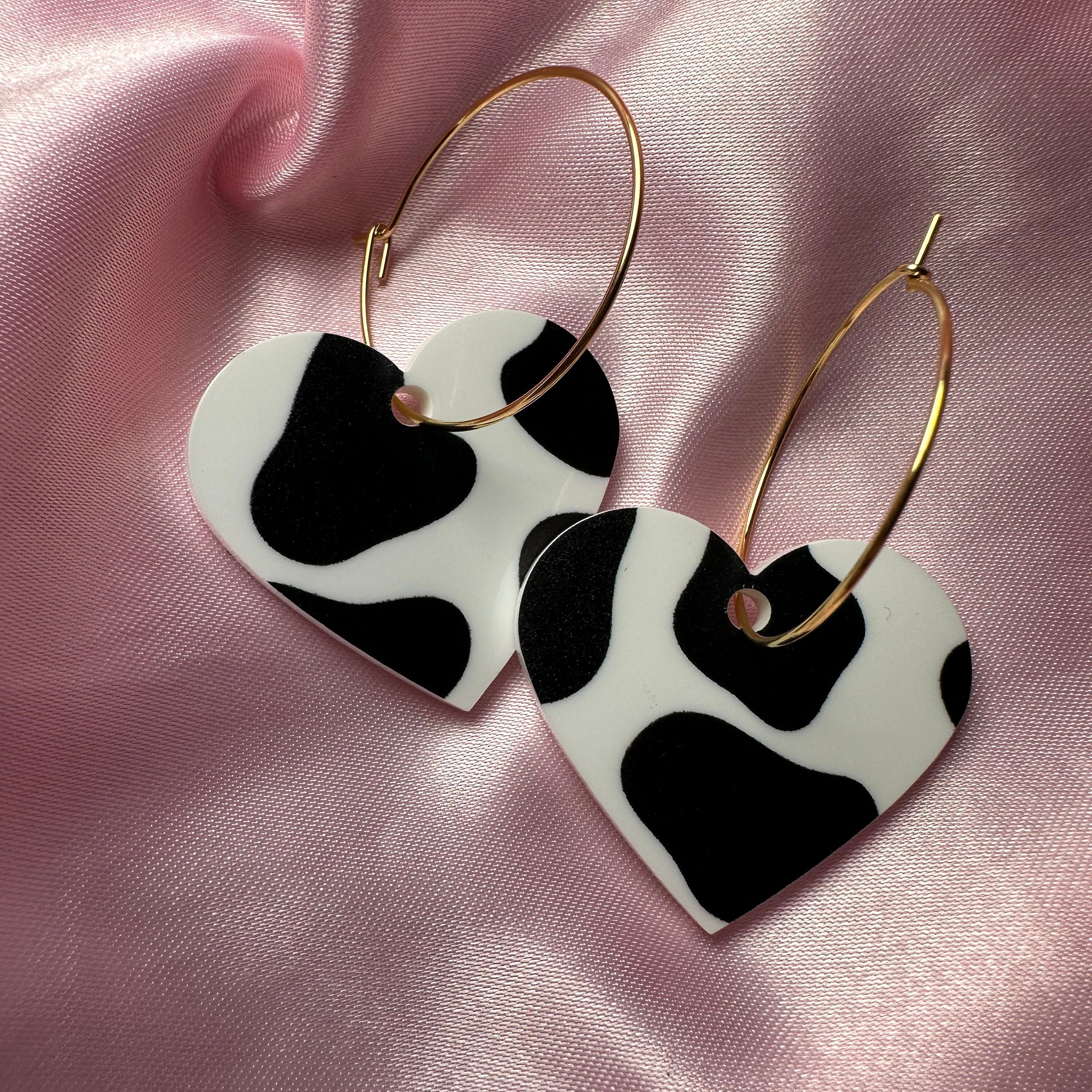 Cow print heart earrings deals