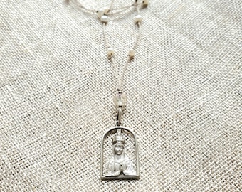 Antique Virgin Mary silhouette charm necklace  .