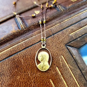 Antique Gold plated Virgin Mary silhouette  charm necklace  !