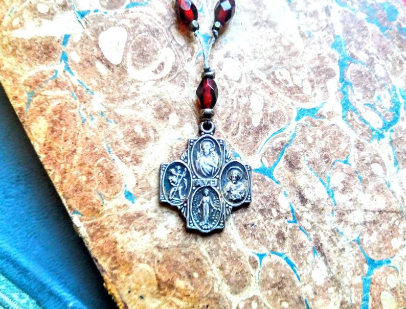 Dual St Christopher and St Joseph cross necklace .