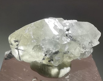 Translucent white calcite with metallic stibnite inclusion, Xikuangshan Mine Hunan Province China, 17mm length xls, B3409