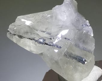 Translucent white calcite with metallic stibnite inclusion, Xikuangshan Mine Hunan Province China, 19mm in length, B3411