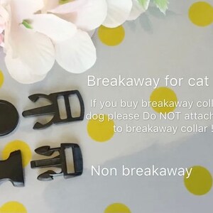May include: Close-up of four black plastic breakaway clasps for collars. The text "Breakaway for cat" and "If you buy breakaway collar for dog please Do NOT attach leash to breakaway collar!!" is written on a white background with yellow polka dots. The text "Non breakaway" is written below the clasps.