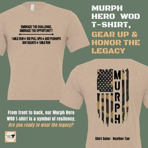 May include: A tan t-shirt with a black graphic on the front that says "Embrace the challenge, embrace the opportunity" and a list of exercises. The back of the shirt has a black and green camouflage American flag with the word "MURPH" in black letters.