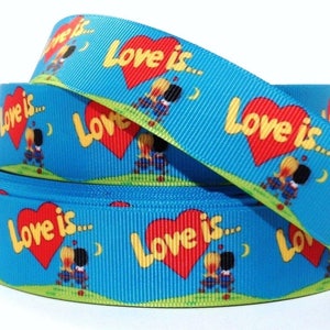 May include: Blue ribbon with a repeating pattern of red hearts and the text "Love is..." with a cartoon couple sitting on a bench.