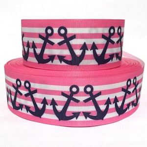 May include: Pink and white striped ribbon with navy blue anchor print.