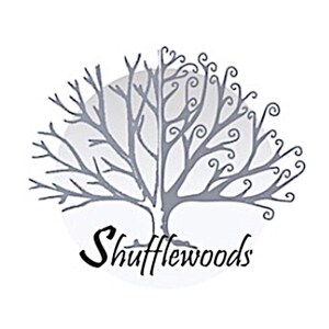 May include: A logo featuring a stylized gray tree with intricate branches and curly accents, set against a soft white circle. The word "Shufflewoods" is written in a cursive font below the tree.