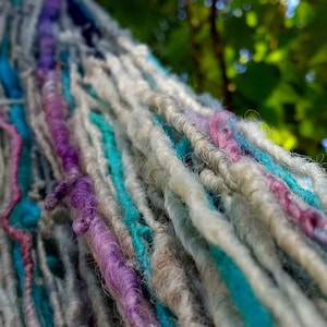 Corespun pink purple teal wool novelty yarn, fuzzy handspun for knitting, crochet, weaving, doll hair
