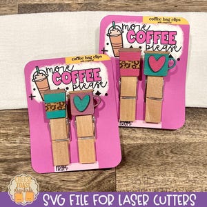 May include: Two pink cards with the text "more coffee please" and a coffee cup design. Each card has two wooden clothespins with a coffee cup and heart design.
