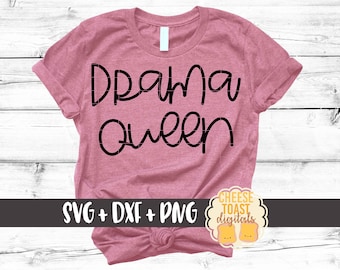 May include: A pink t-shirt with the text "Drama Queen" in black script. The shirt is tied in a knot at the bottom. The text "SVG + DXF + PNG" is visible below the shirt. A small logo with the text "CHEESE TOAST digitals" is visible in the bottom right corner.