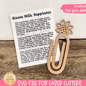 May include: A wooden sunflower bookmark with a paper card that reads "Bloom With Happiness". The card features a quote about the sunflower symbolizing joy and positivity. The bookmark is designed for laser cutting.