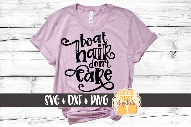 May include: A pink t-shirt with the text "boat hair don't care" in black. The shirt is on a white wood background. The text "SVG + DXF + PNG" is below the text on the shirt. A small logo with the text "CHEESE TOAST digitals" is in the bottom right corner of the image.
