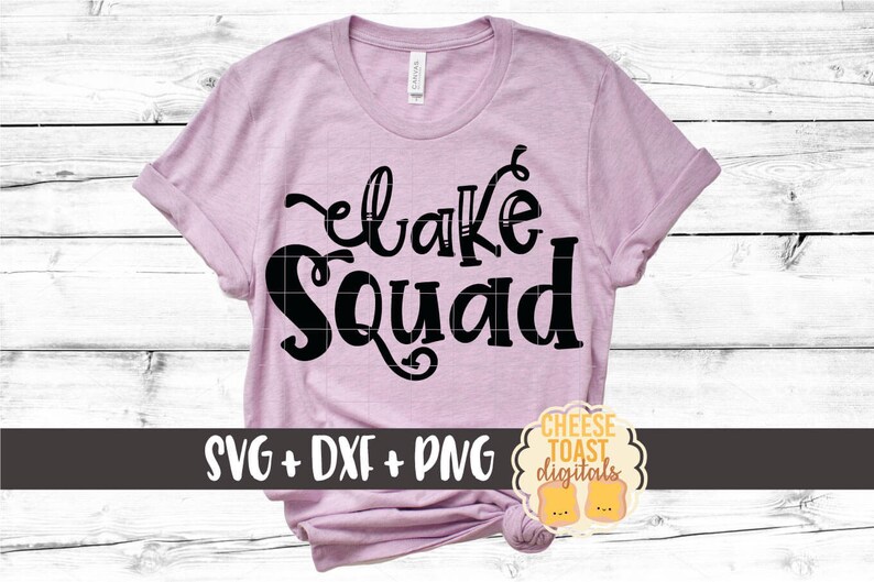 May include: A pink t-shirt with the text "Lake Squad" in black lettering. The shirt is on a white wood background. The text "SVG + DXF + PNG" is at the bottom of the image.