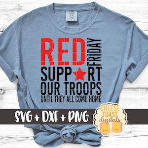 May include: A light blue t-shirt with the text "RED FRIDAY SUPPORT OUR TROOPS UNTIL THEY ALL COME HOME" in black and red lettering. A red star is between the words "SUPPORT" and "OUR".