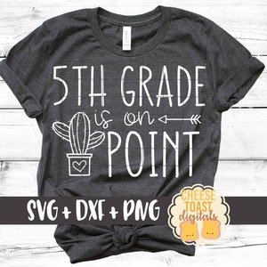 May include: A dark gray t-shirt with the text "5th Grade is on Point" in white. A white cactus with a heart in a pot is to the left of the text. An arrow points to the right of the text. The text "SVG + DXF + PNG" is at the bottom of the shirt.