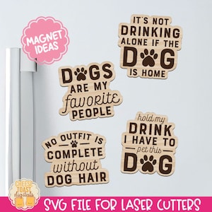 May include: Four wooden refrigerator magnets with dog-themed sayings. The magnets feature brown text on a light brown background. The sayings are "Dogs are my favorite people", "It's not drinking alone if the dog is home", "No outfit is complete without dog hair", and "Hold my drink I have to pet this dog".