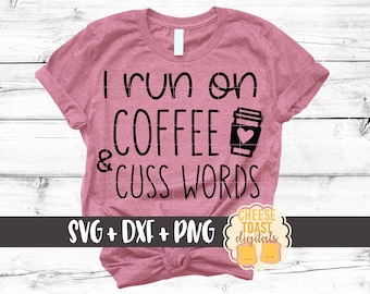 May include: A dusty rose t-shirt with the phrase "I run on COFFEE & CUSS WORDS" in black lettering. A black coffee cup graphic with a heart is next to the word "COFFEE". The bottom of the shirt has the text "SVG + DXF + PNG".