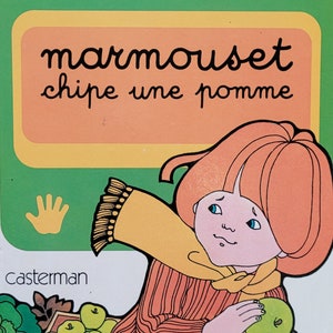 May include: A vintage children's book cover with a green, yellow, and orange color scheme. The title is "marmouset chipe une pomme" and the author is "dina-k. tourneur". The cover features an illustration of a child holding an apple.