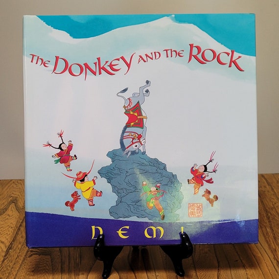 The Donkey and the Rock, a Tibetan folk tale by Demi, 1999 first edition.