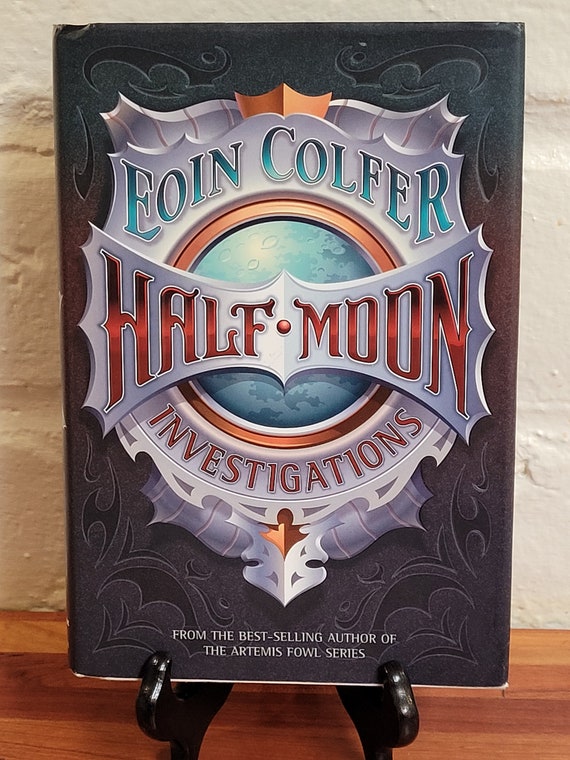 Half-Moon Investigations, 2006 first US edition, by Eoin Colfer.