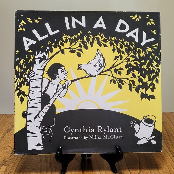 All In A Day by Cynthia Rylant and Nikki McClure, 2009 edition.