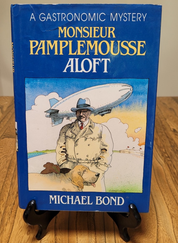 Monsieur Pamplemousse Aloft, A Gastronomic Mystery by Michael Bond, 1989 first American edition.