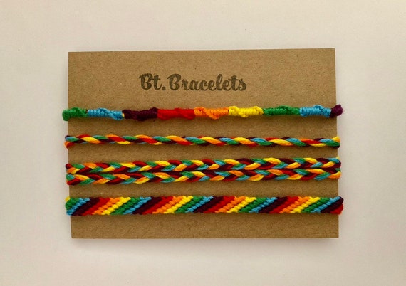 Set of four friendshipbracelets rainbow pride colors bracelets or anklets