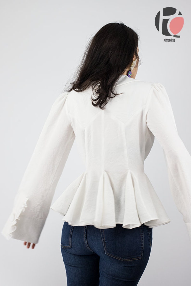 May include: White long-sleeved blouse with a ruffled peplum hem and gathered sleeves. The blouse has a fitted bodice and a slightly flared skirt.