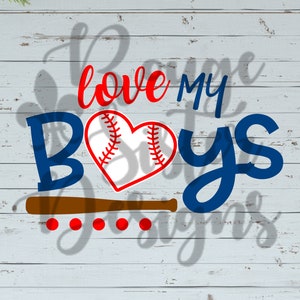 May include: A blue and red graphic design with the text "love my boys" and a baseball with red stitching in the center. The design is on a white wood background.