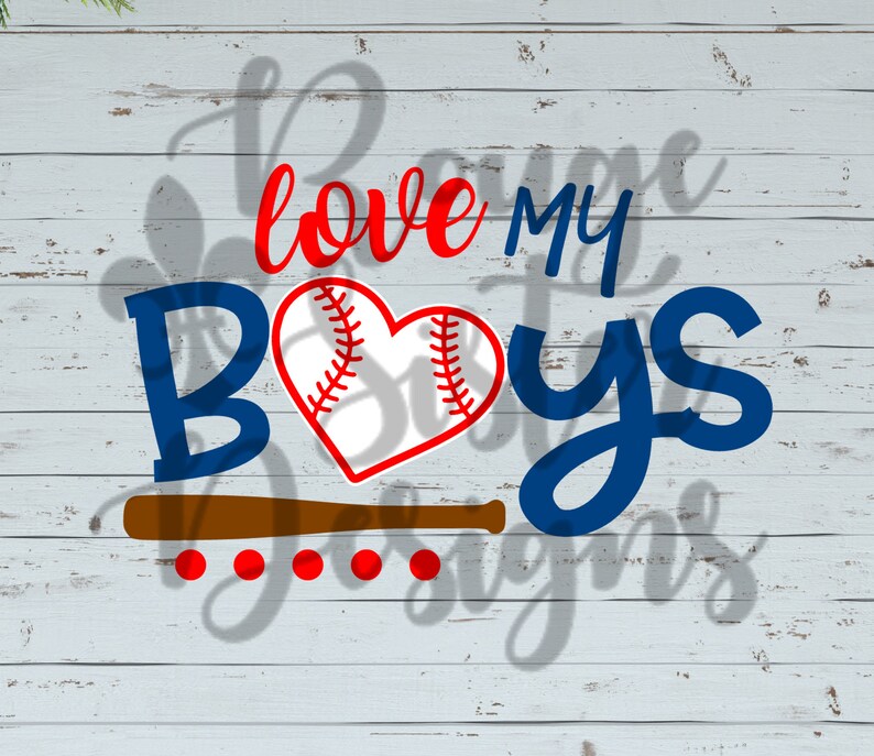 May include: A blue and red graphic design with the text "love my boys" and a baseball with red stitching in the center. The design is on a white wood background.