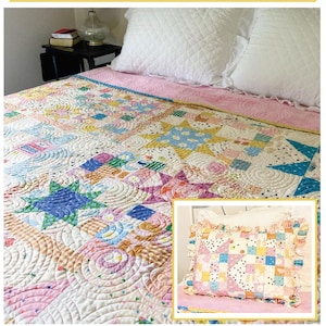 May include: A colorful quilt and pillow sham set with the text "Sunny Days". The quilt measures 70" x 80" and features a patchwork design with various shapes and colors. The pillow sham has a matching design. The pattern is by Amy Pinkos.