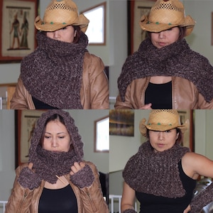 May include: A brown knitted scarf with a hood can be worn in four different ways. The scarf is shown being worn by a person wearing a brown leather jacket and a brown straw hat.