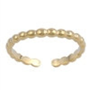 May include: A gold-colored toe ring with a beaded design. The ring is open at the front and appears to be adjustable. The ring is made of a shiny metal and is displayed against a white background.
