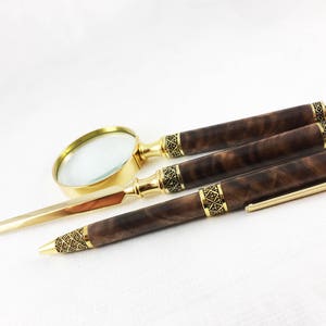 Sculptured Gold Figured Black Walnut Letter Opener, Magnifying Glass and Wood Pen Desk Set