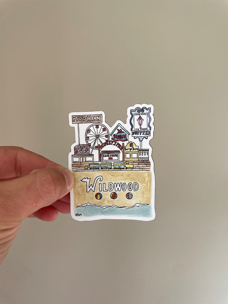 May include: A colorful illustration of a Wildwood, New Jersey boardwalk scene with a Ferris wheel, shops, and beach balls. The text "Wildwood" is written in a stylized font.