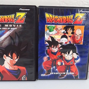 May include: Two Dragon Ball Z DVD cases. The left case is black with Goku and the text "The Movie The Tree of Might". The right case is blue with multiple characters and the text "Pendulum Room".