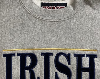 Suéter Jansport de manga larga para adultos de la Universidad de Notre Dame (gris, pequeño, S)