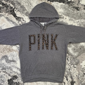 May include: A distressed wooden sign, inscribed with "Welcome to our home" in white. The sign has a rustic appearance, ideal for adding a welcoming touch to any home's entrance.