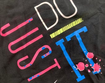 Camiseta Nike vintage de manga larga con estampado "Just Do It" para mujer (negra, talla XS)