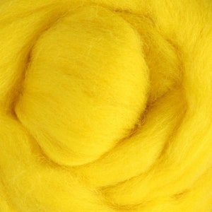 May include: A close-up of a bright yellow wool roving. The wool is soft and fluffy, and it is perfect for felting or spinning.
