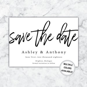 May include: Save the date card with black calligraphy text that says "save the date" and the names "Ashley & Anthony". The card also includes the date "June first, two-thousand eighteen", the location "Brighton, Michigan", and the text "formal invitation to follow".