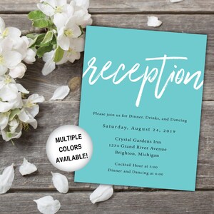 May include: A turquoise blue wedding reception invitation with white text. The invitation reads "Reception" in a large, handwritten font. The text also includes the date, time, and location of the reception. The invitation is decorated with a white flower.