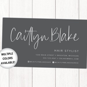 May include: A grey business card with white text. The card reads "Caitlyn Blake Hair Stylist" and includes contact information: 1234 Main Street, Brighton, Michigan, 555.123.4567, cblake@mail.com, @caitlynblakehair, @caitlynblakehairco.