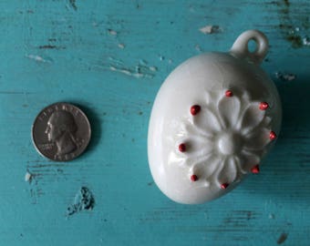 Hand-made and glazed egg shaped ornament