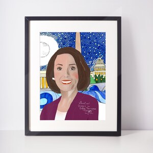 May include: A framed illustration of a woman with brown hair wearing a purple jacket. The background is a blue and white watercolor design with a building that resembles the US Capitol building. The text "American's Desire a Better Tomorrow. Today." is written in black ink.