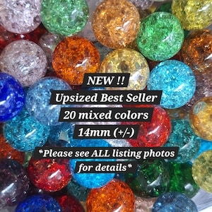 May include: A collection of round, crackle-glass beads in various colors including red, blue, green, orange, and yellow. Text overlay reads: NEW !! Upsized Best Seller 20 mixed colors 14mm (+/-) *Please see ALL listing photos for details*