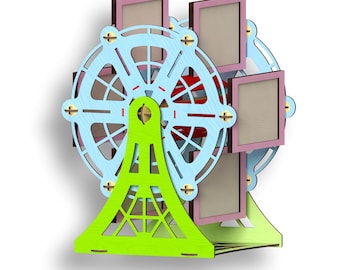 May include: A wooden Ferris wheel photo holder with four frames. The frames are in pastel pink, light blue, and beige. The Ferris wheel is painted green and blue.
