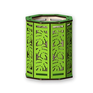 May include: A green hexagonal pencil holder with a cutout design of tropical leaves. The holder is made of wood and has a dark brown top.