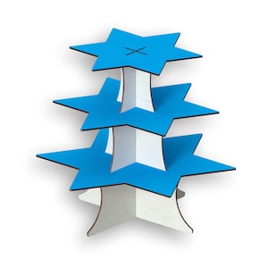 May include: A three-tiered star-shaped display stand. Each tier is a bright blue star with a black 'X' on the top tier. The supports are white with a wood grain appearance. The stand is designed to hold items for display.