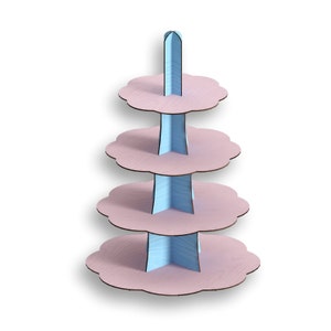 May include: A four-tiered cake stand made of cardboard with a light blue and pink color scheme. The stand has a scalloped edge and is perfect for displaying cupcakes, cookies, or other treats.